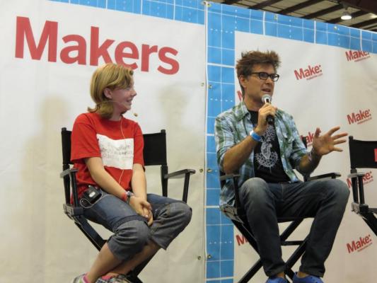 Sylvia sits on stage at Maker Faire Bay Area 2013 being interviewed by Mark Frauenfelder, Editor in Chief of Make Magazine.