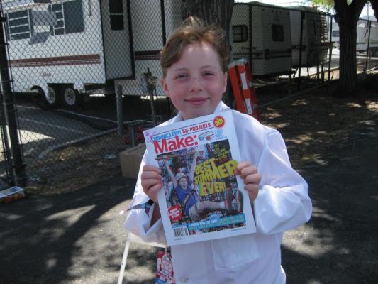 Sylvia holding a signed Make Magazine Schools out Special Edition