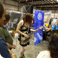 Jeri Ellsworth showing off her Commodore-64 bass guitar project
