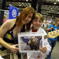 Jeri Ellsworth posing with Sylvia and a picture of them from Maker Faire 2011