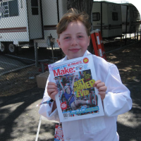 Sylvia holding a signed Make Magazine Schools out Special Edition