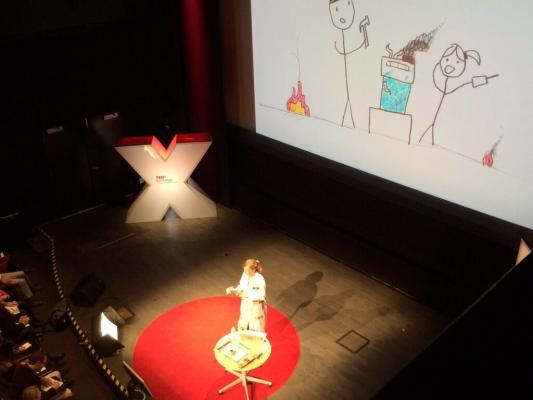 Sylvia giving her talk on stage at TEDx San Diego 2013.