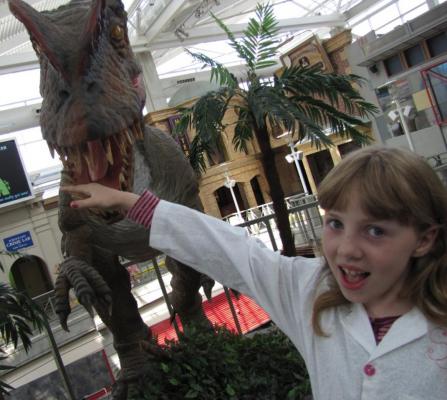 Sylvia getting "bitten" by a utahraptor in Science City, Union Station.