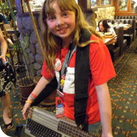 Sylvia posing with Jeri's C-64 Bass guitar.