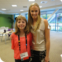 Sylvia stands to the left of Olympic Gold Medallist Dana Vollmer