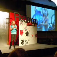 Sylvia speaks on stage at TEDx Redmond on September 15th, 2012
